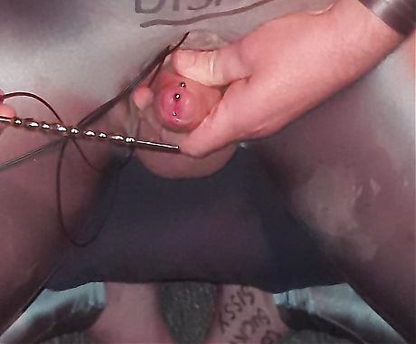 Sissy playing with electric shock penis plug